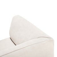 Cream-colored fabric sofa corner with a smooth, textured finish, featuring a minimalist design and clean lines.