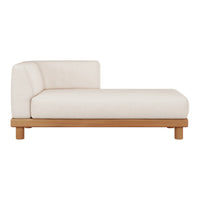 Cream-colored chaise lounge with a smooth texture and natural wooden legs, featuring a minimalist modern design.