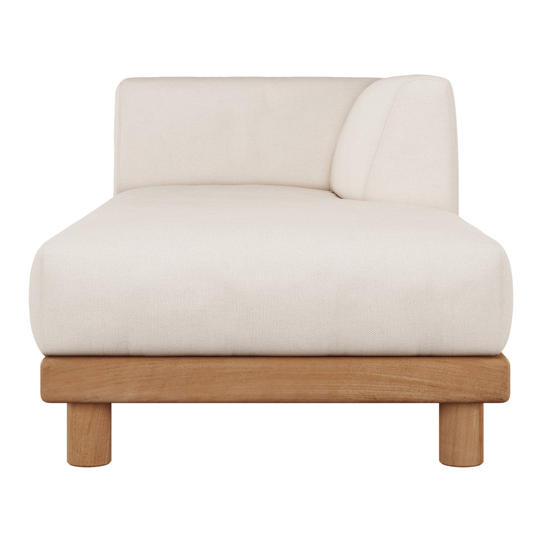 Cream-colored chaise lounge with a smooth fabric finish and natural wooden legs. Minimalist design with a single armrest.