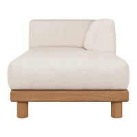 Cream-colored chaise lounge with a smooth fabric finish and natural wooden legs. Minimalist design with a single armrest.