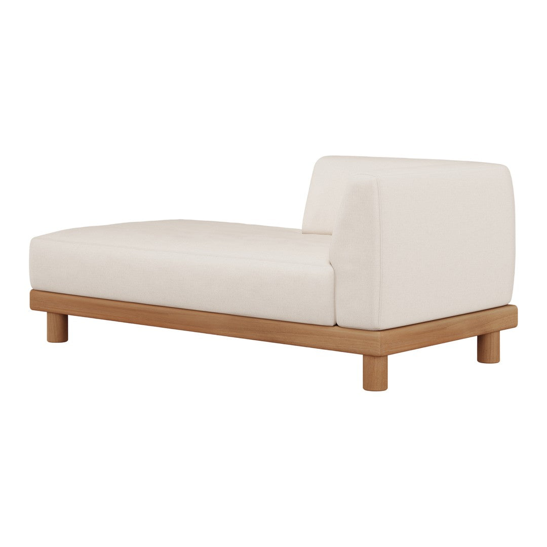 "Minimalist chaise lounge in soft cream upholstery with a light wood base, perfect for modern decor."