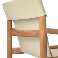 Beige upholstered chair with natural wood frame, showcasing minimalist design and neutral color palette.