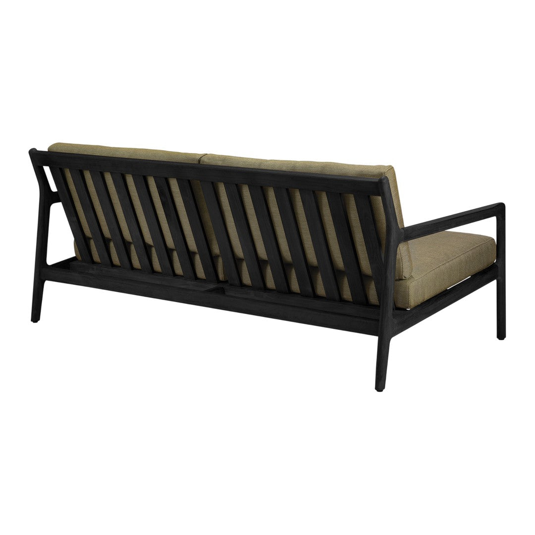Black wooden frame sofa with tan cushions, featuring a slatted back design. Ideal for contemporary decor.