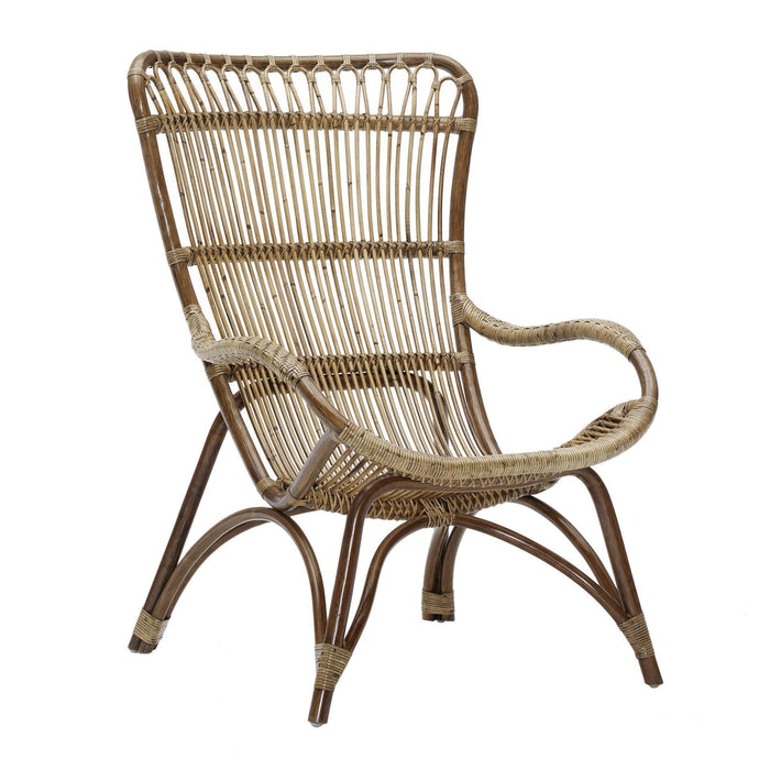 Natural woven rattan chair featuring a curved design and a light brown finish with vertical stripes. Perfect for bohemian decor.