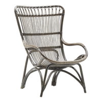 Gray rattan chair with intricate open weave and curved design, adding a relaxed, modern touch to any space.