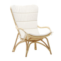 Cream-colored cushioned chair with a natural rattan frame and smooth, minimalist design. Ideal for stylish interiors.