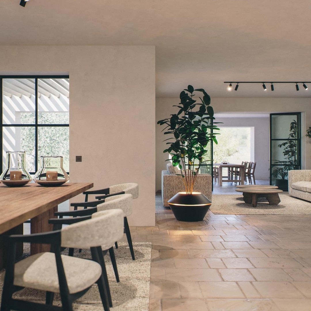 Modern interior featuring neutral tones, textured beige tiles, and minimalist black and white furniture with natural accents.