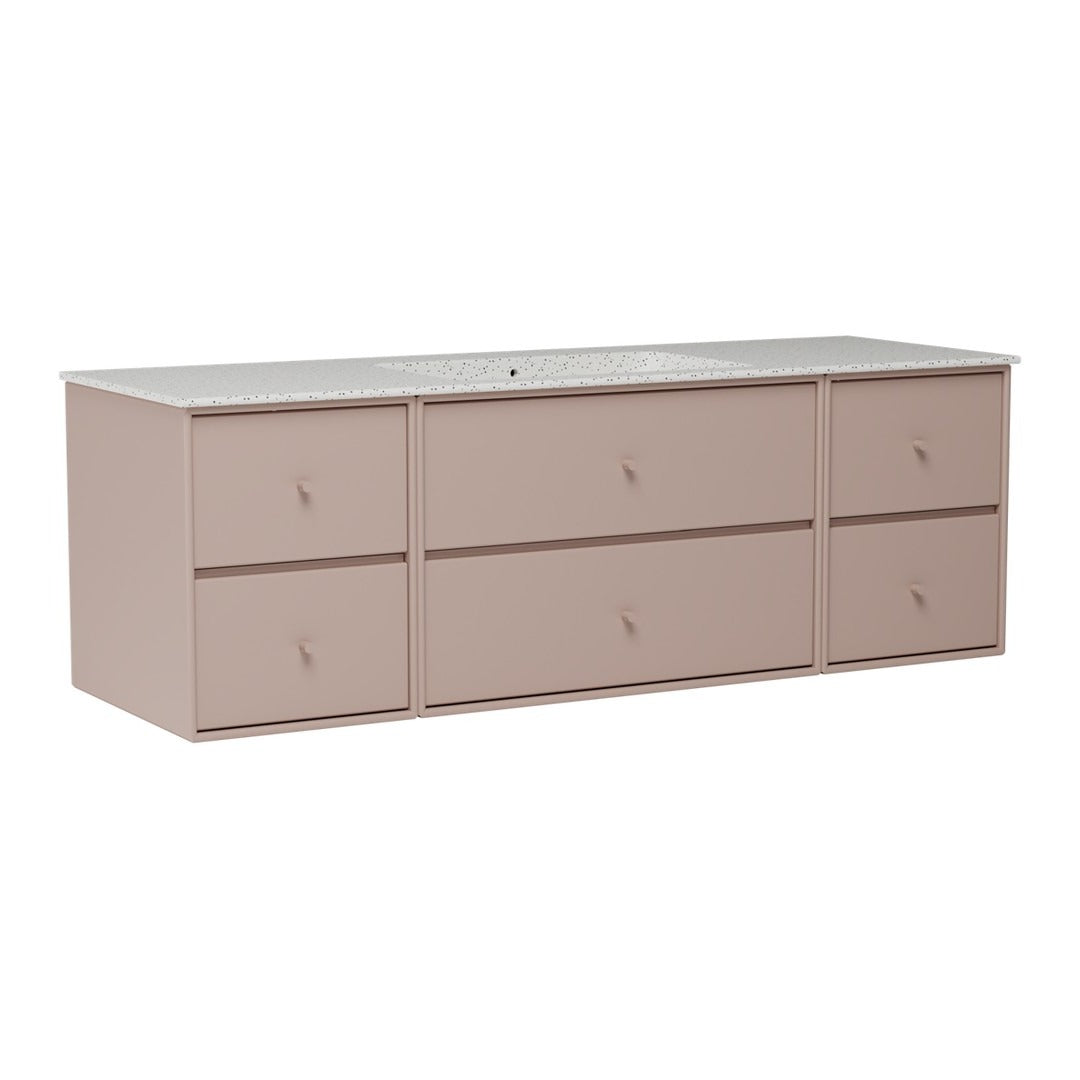 Light pink storage cabinet with a smooth white countertop and minimalist drawer design. Perfect for modern décor.