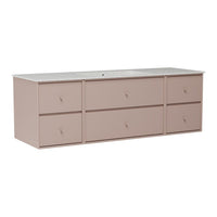 Light pink storage cabinet with a smooth white countertop and minimalist drawer design. Perfect for modern décor.