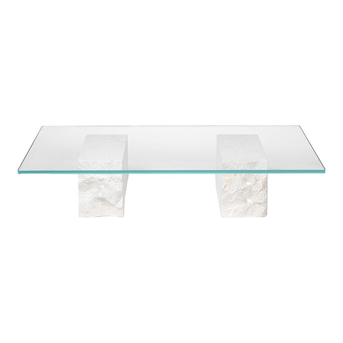 Clear glass coffee table with white textured stone legs, offering a minimalist and modern design.