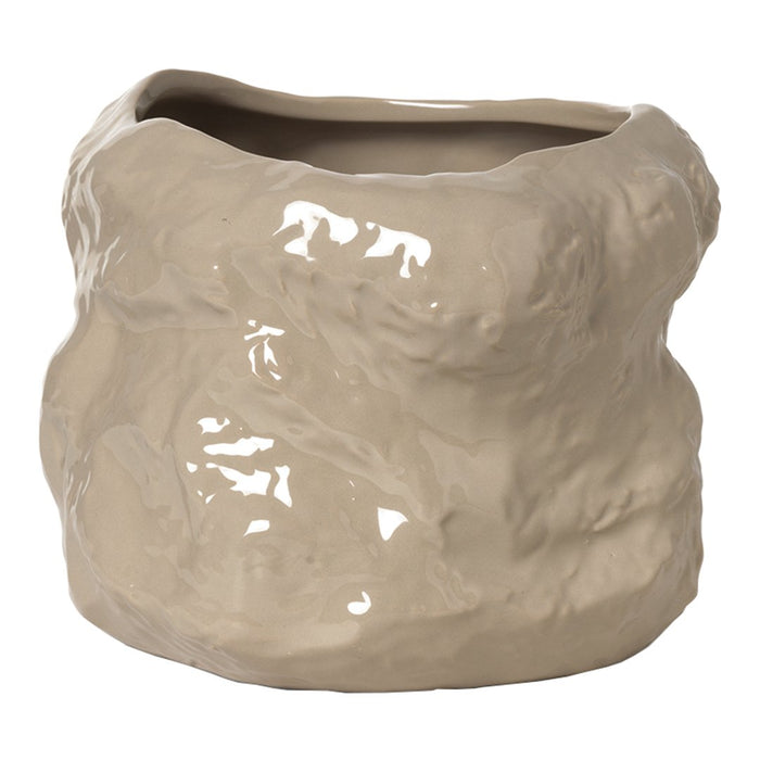 Textured beige ceramic planter with a glossy finish and an organic, wavy shape. Ideal for modern decor.