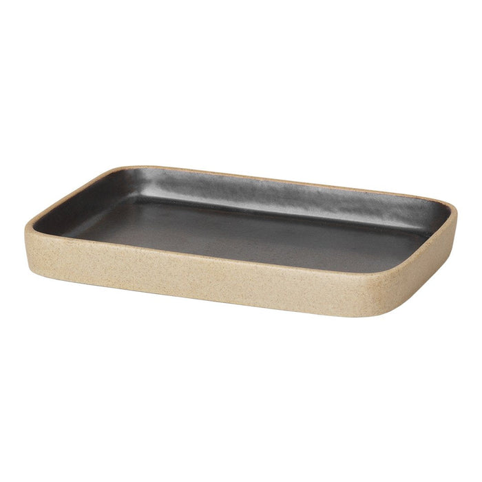 Rectangular ceramic tray featuring a sleek black interior and a textured beige exterior. Modern and stylish design.