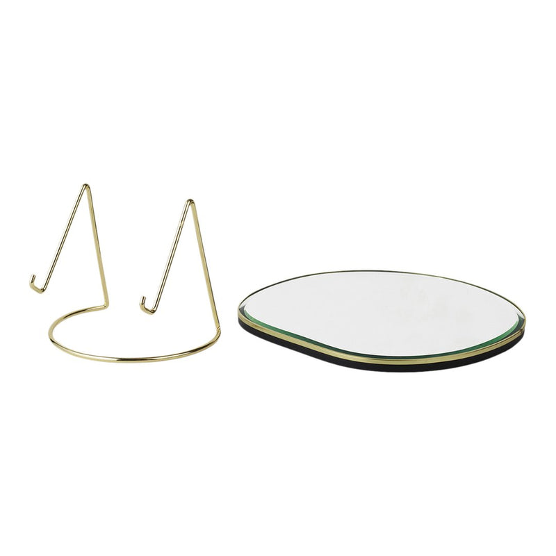 Gold wire stand with a smooth, circular black and white base featuring a subtle green outline.