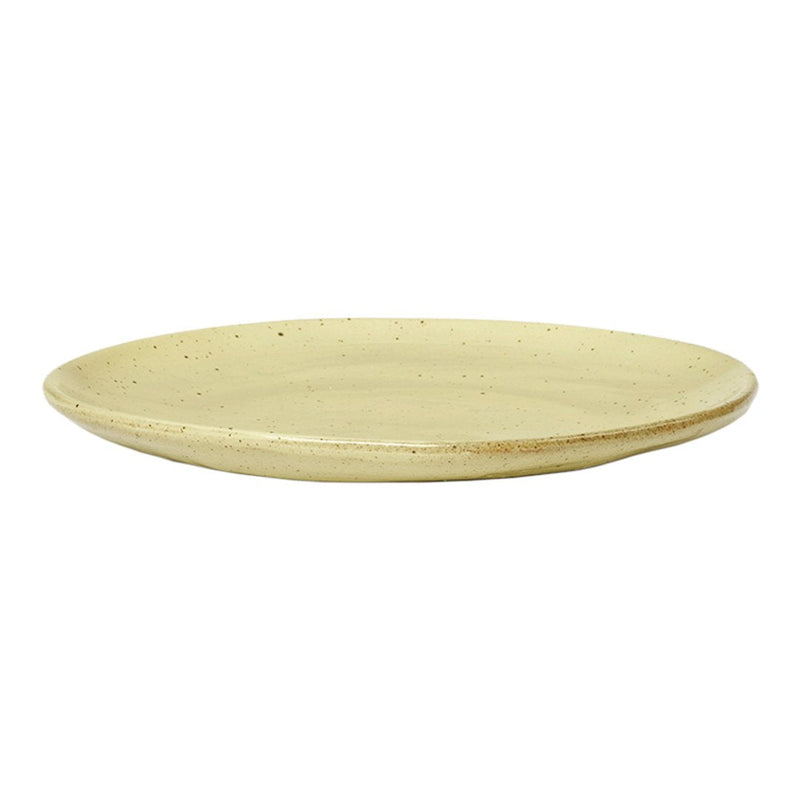 "Round ceramic plate in soft beige with subtle speckles and a smooth, matte finish."