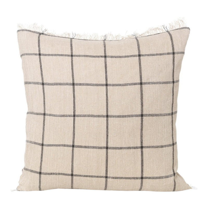 Beige plaid cushion with black grid pattern and fringe detailing, perfect for cozy home decor.