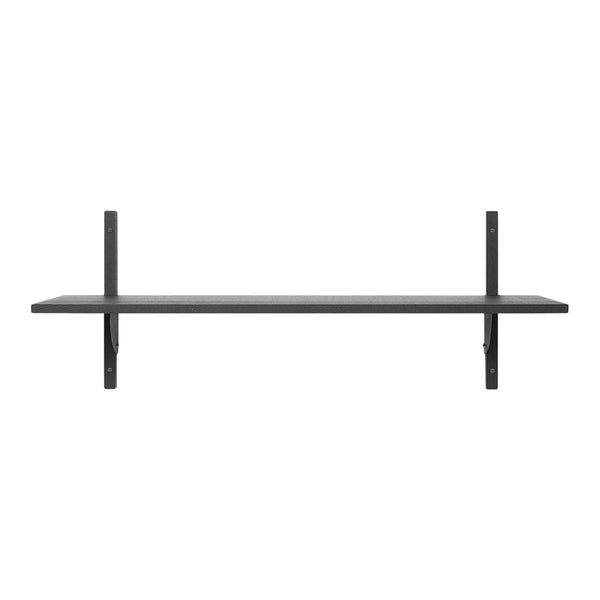 Minimalist black wall shelf with a sleek design, featuring a smooth surface and simple geometric lines.
