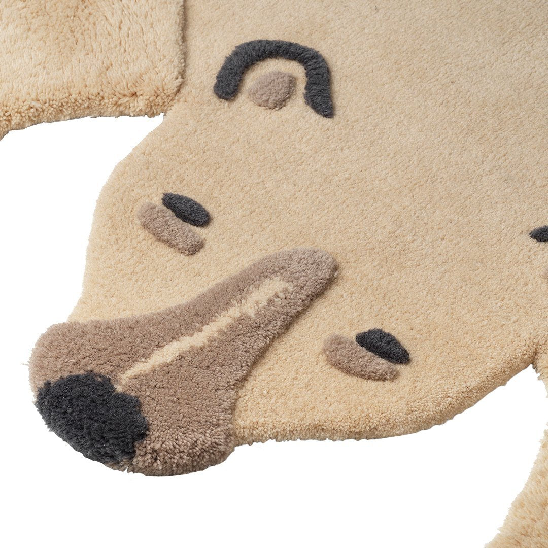 Tan and brown animal-themed rug with soft, textured pattern, featuring a bear face design, perfect for kids' rooms.