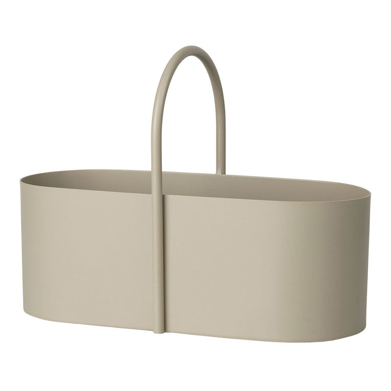 Light beige oval basket with a smooth, minimalist design and a curved handle, ideal for stylish storage solutions.