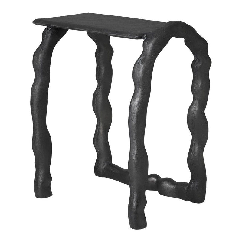 Black textured stool with wavy, sculptural legs and a sleek rectangular top, showcasing modern design aesthetics.