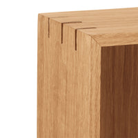 Light oak wood texture with visible joinery patterns, showcasing natural grain and warm tones.