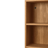 Light oak wood cabinet with a smooth, natural finish and subtle wood grain pattern. Perfect for modern decor.