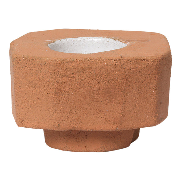 Terracotta planter with a textured matte finish and a white inner rim. Unique hexagonal shape enhances modern decor.