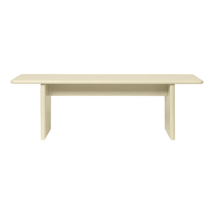 "Modern beige dining table with a sleek, minimalist design and smooth, solid surface."