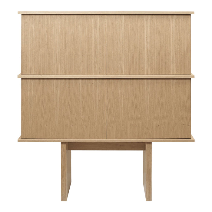 Light oak wood cabinet with a smooth, minimalistic design featuring horizontal and vertical paneling.