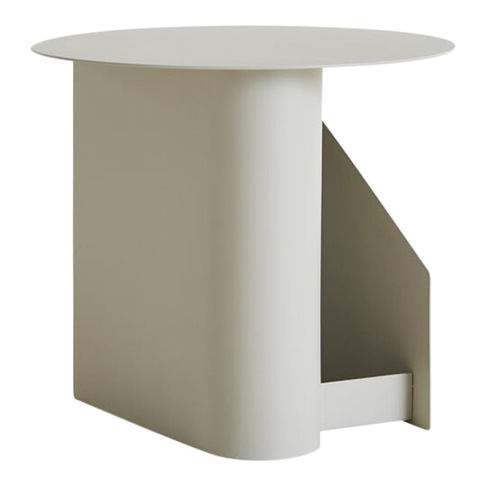 Modern round side table in a soft beige color with smooth, minimalistic design and geometric patterns.