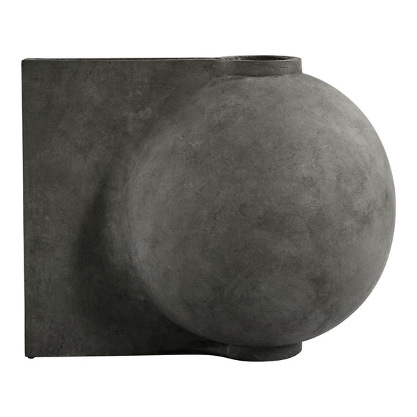 Textured matte black wall sconce with a spherical design, adding a modern touch to any space.