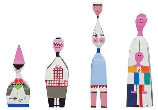 Colorful wooden figurines featuring pink, blue, green, and unique patterned designs. Perfect for home decor.