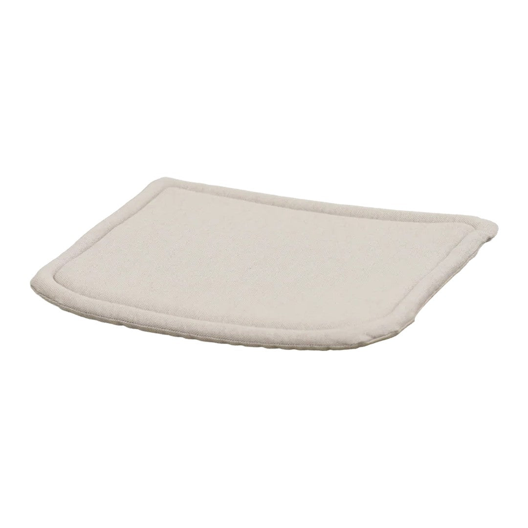 Light beige cushion with a smooth texture and rounded edges, perfect for a minimalist and neutral decor style.