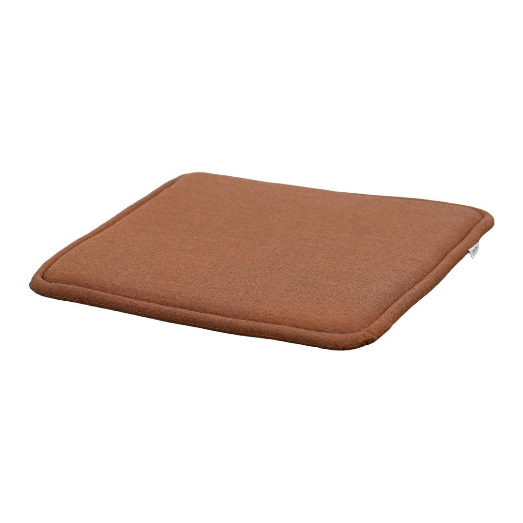 Brown square cushion with a smooth texture, perfect for adding warmth and comfort to any space.