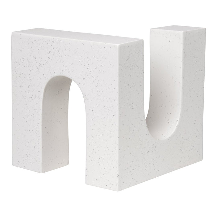 Modern white geometric bookend with a speckled texture, featuring a bold, unique 'U' shape design.