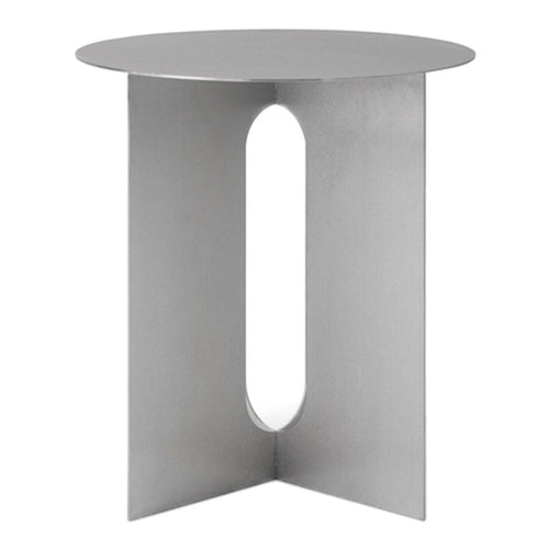 Modern silver side table with a sleek circular top and geometric cutout design. Minimalist style enhances any decor.