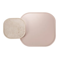 "Two decorative trays: one smooth blush pink, one textured off-white, both featuring modern square shapes."