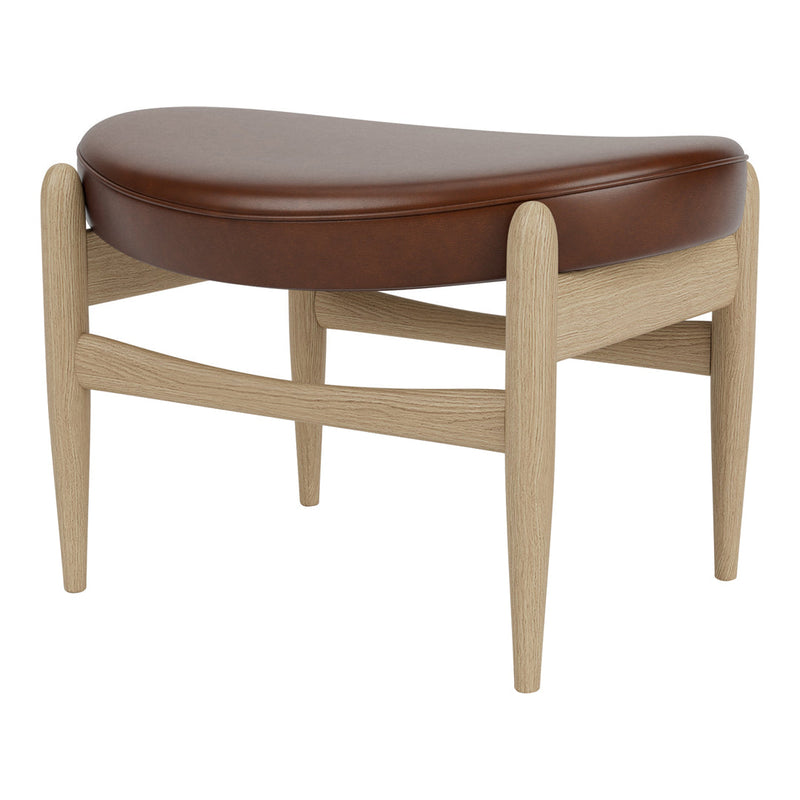 Brown leather padded ottoman with a light wood frame and curved shapes, complementing modern decor.