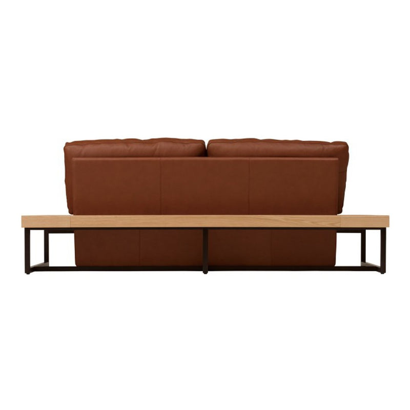 Brown leather sofa with a natural wood and black metal base, featuring a sleek, modern design.
