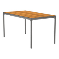 Rectangular table with a warm orange wood top and sleek gray metal legs, featuring simple, modern lines.