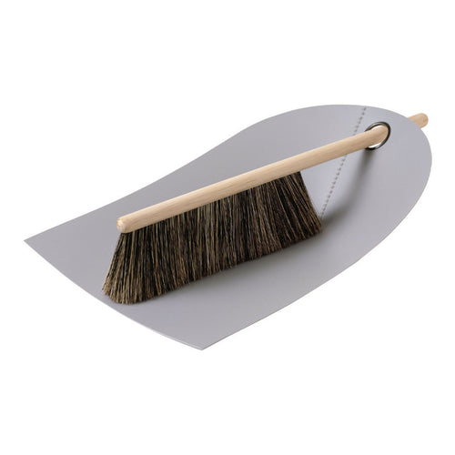 Gray dustpan with a brown bristle broom, showcasing a minimalistic design and natural wood handle.