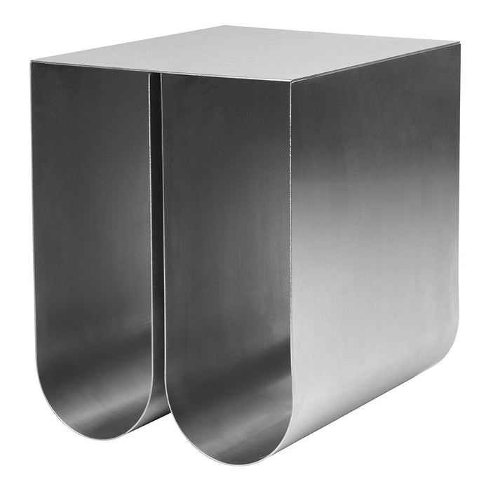Sleek silver metal side table with smooth, curved edges and a modern, minimalist design.