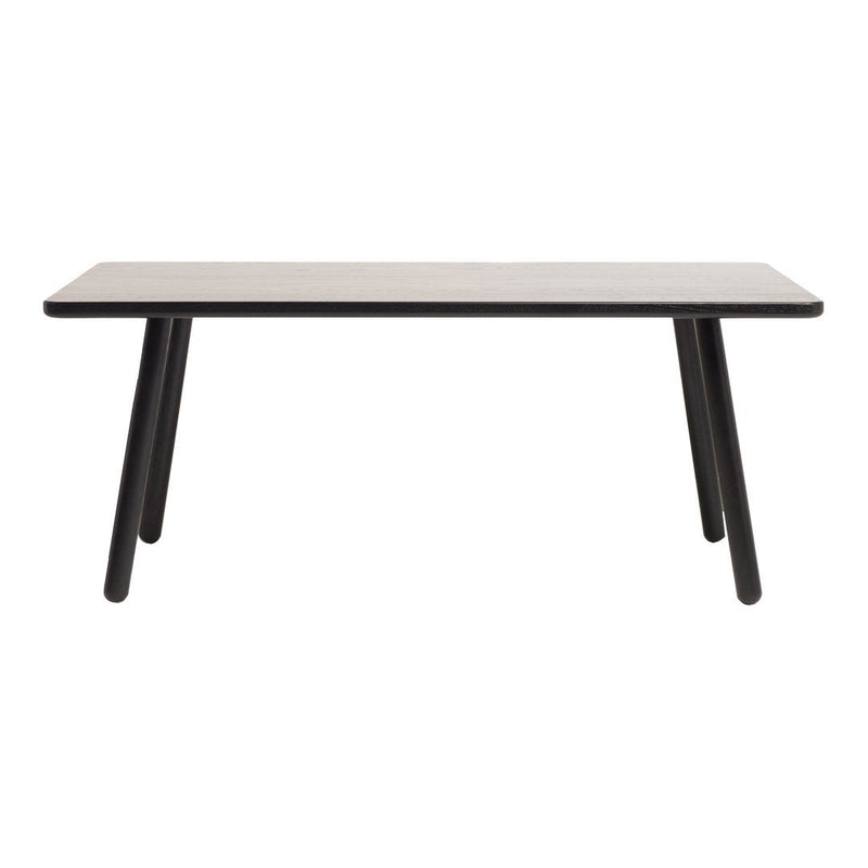 Modern rectangular table with a light grey top and black tapered legs, featuring a minimalist design.
