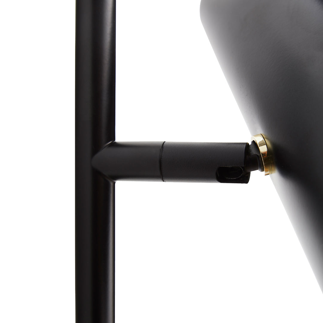 Black metal lamp base with a sleek design and gold accents, showcasing a modern minimalist style.