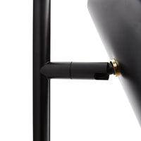 Black metal lamp base with a sleek design and gold accents, showcasing a modern minimalist style.