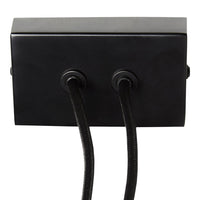 Black box with two circular connectors and textured black cables, creating a sleek, modern design.