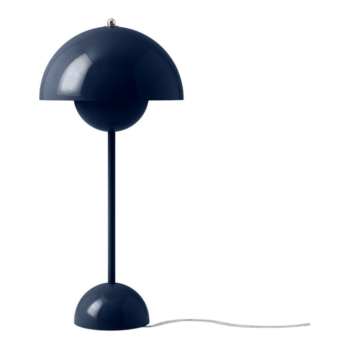 Navy blue table lamp with a sleek dome shade and round base. Modern design with a minimalist aesthetic.