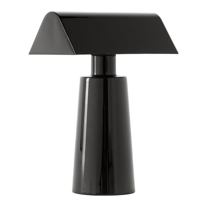 Black modern table lamp with a geometric design and sleek, shiny finish. Perfect for contemporary decor.