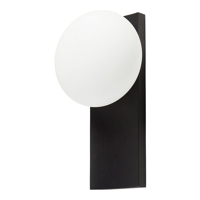 Black wall-mounted light fixture with a round white glass shade, creating a modern and stylish contrast.