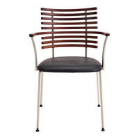 Brown slatted backrest, black cushioned seat, and metallic legs combine for a modern, stylish chair design.