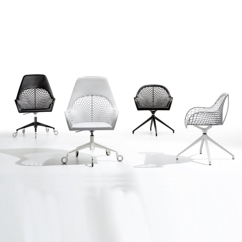 Set of four modern chairs in black and white, featuring geometric patterns and sleek, minimalist designs.